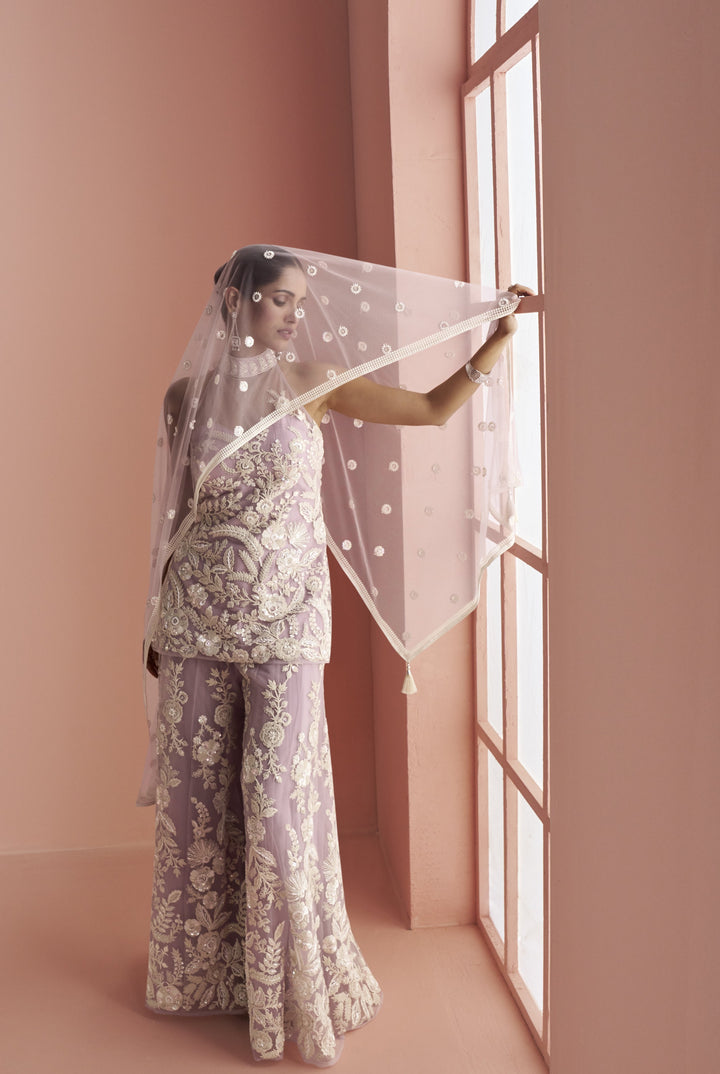 sleeveless halter top paired with palazzo designer dress in net