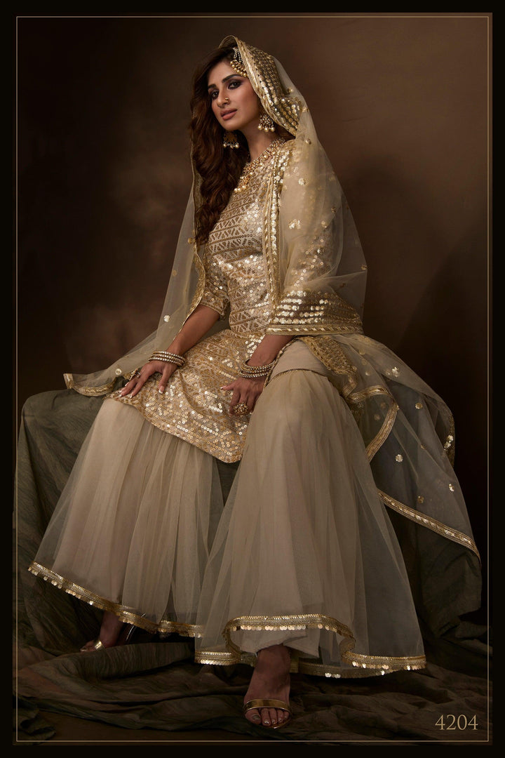 Reception Wear Dusky Beige Net Designer Sharara Suit - Fashion Nation